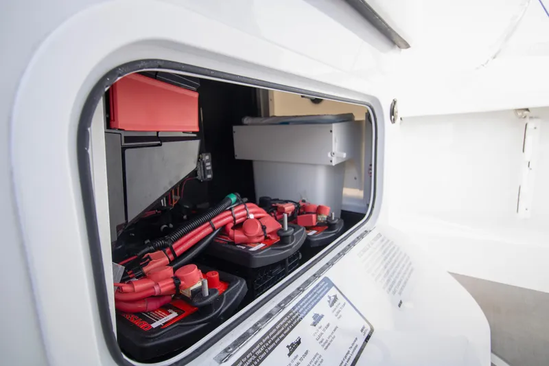 Slide: The Image of Battery compartment of 2025 Yellowfin 32 Offshore boat, showcasing electrical components. - 22