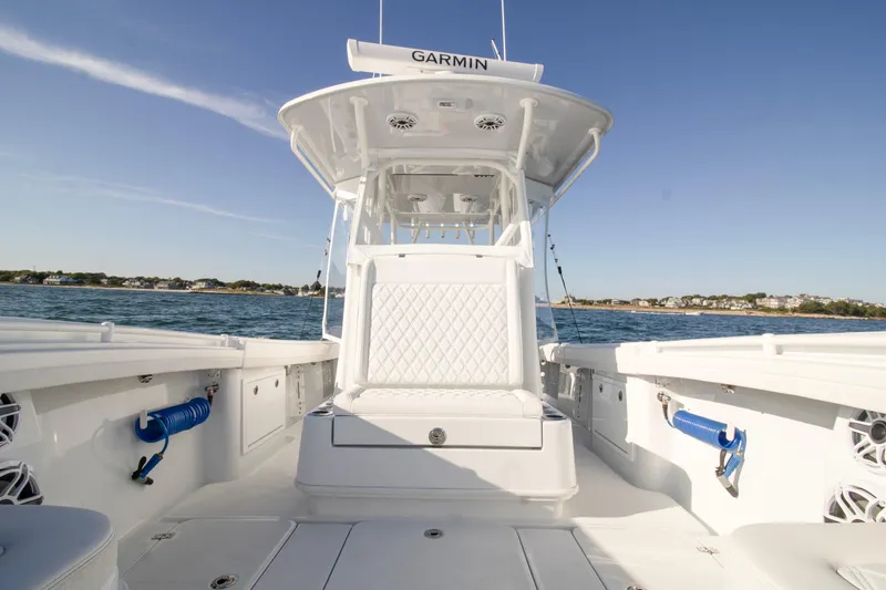 Slide: The Image of 2025 Yellowfin 32 Offshore boat interior with Garmin equipment on open water. - 8