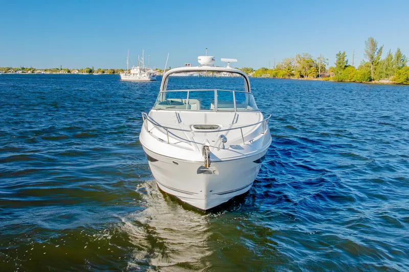 Slide: The Image of 2013 Sea Ray 370 Venture cruising on a sunny day in a scenic waterway. - 2