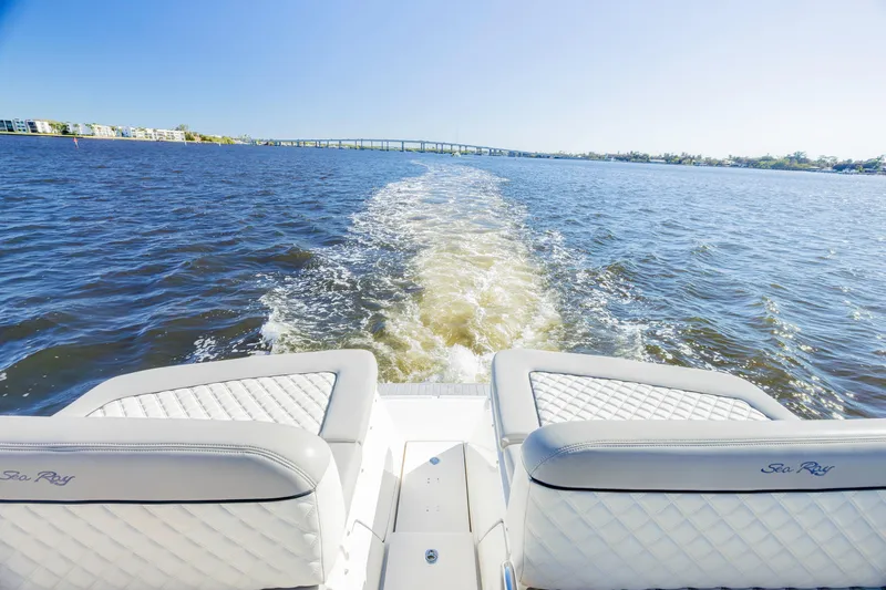 Slide: The Image of 2013 Sea Ray 370 Venture cruising on open water, leaving a wake behind. - 20