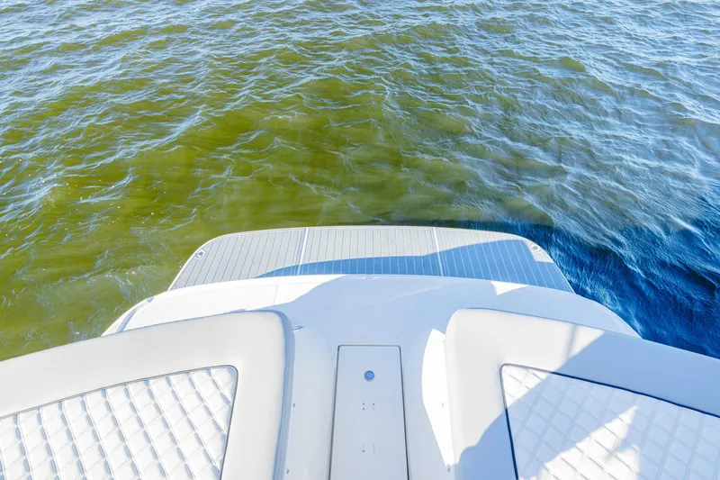 Slide: The Image of 2013 Sea Ray 370 Venture boat stern on calm water. - 27