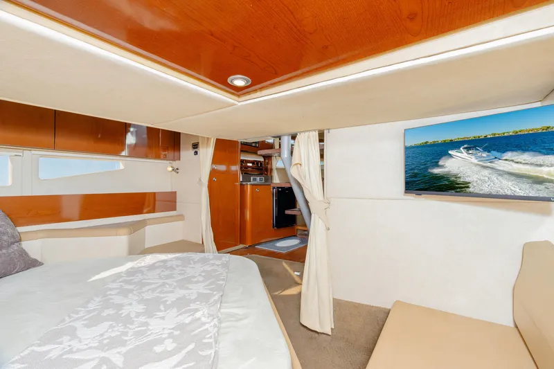 Slide: The Image of Luxurious interior of 2013 Sea Ray 370 Venture yacht with cozy bed and modern amenities. - 30