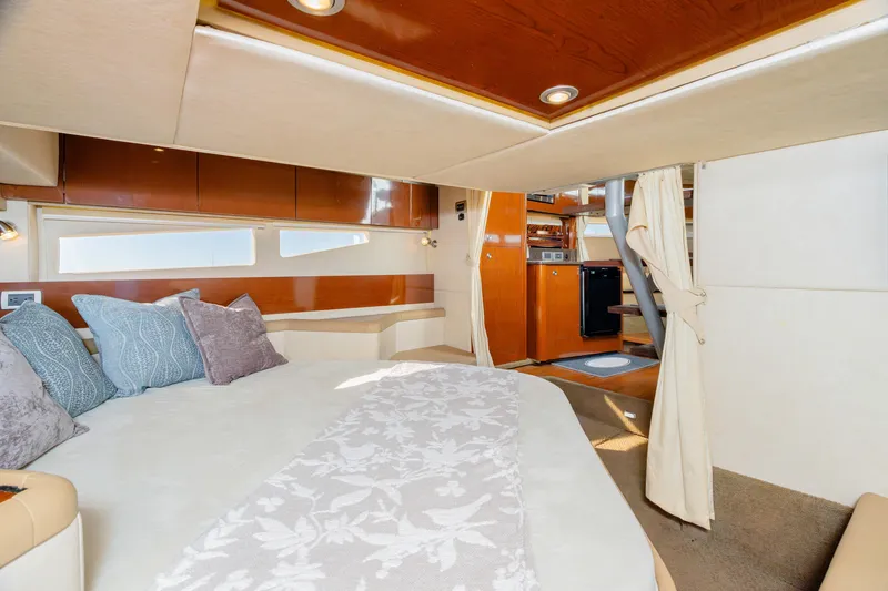 Slide: The Image of Luxurious interior of 2013 Sea Ray 370 Venture yacht with cozy bedroom and modern amenities. - 32