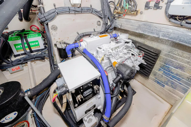 Slide: The Image of Engine room of 2013 Sea Ray 370 Venture with visible components and wiring. - 37