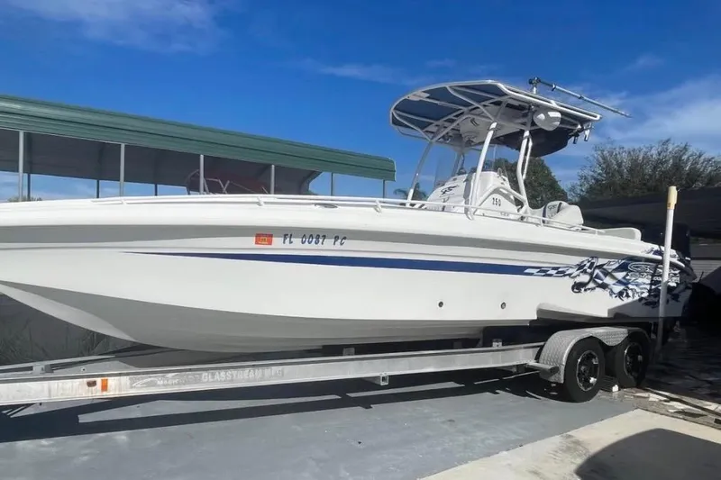 Slide: The Image of 2010 Glasstream 280 SCX boat on trailer under clear blue sky. - 1