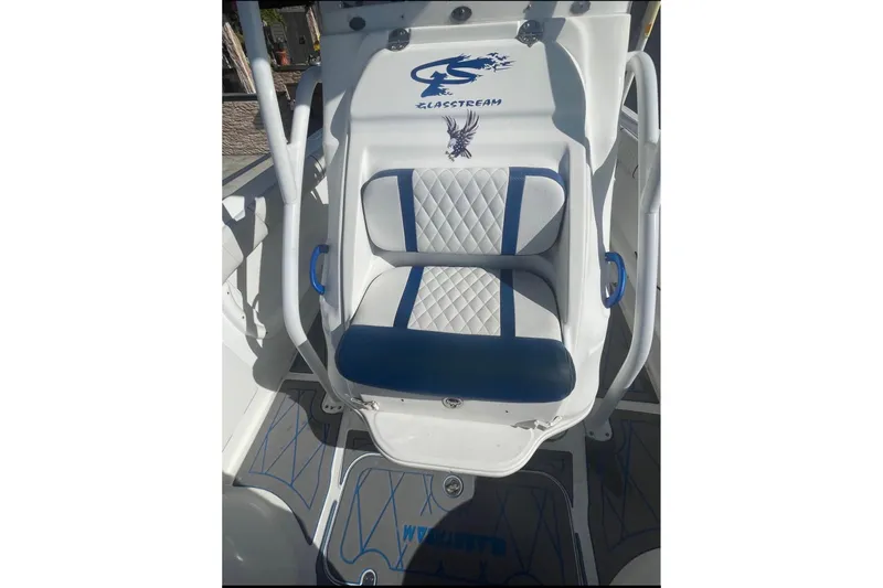 Slide: The Image of 2010 Glasstream 280 SCX boat seat with blue and white upholstery design. - 12