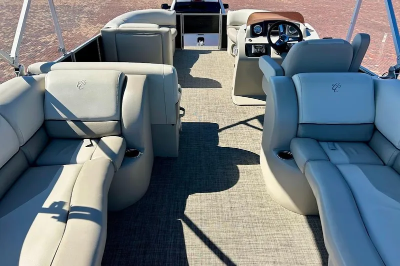 Slide: The Image of 2023 Cypress Cay Seabreeze 232 interior with luxurious seating and modern dashboard. - 9