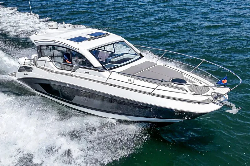 Slide: The Image of 2020 Four Winns Vista 355 Coupe OB cruising on open water. - 0