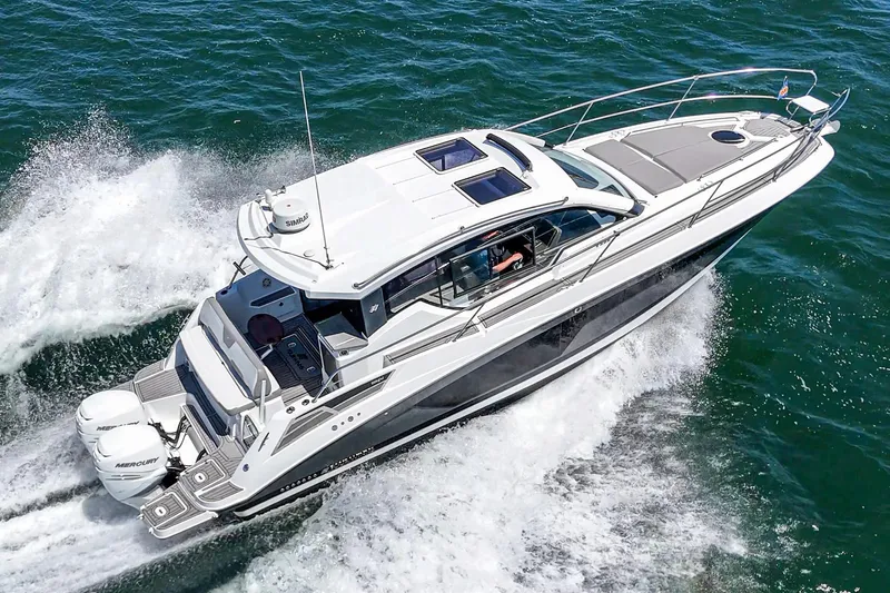 Slide: The Image of 2020 Four Winns Vista 355 Coupe OB cruising on open water. - 10