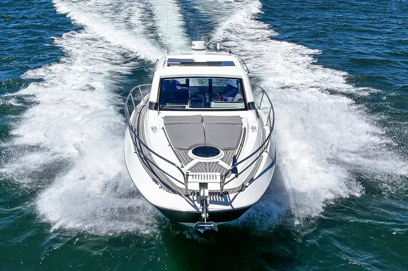 Slide: The Image of 2020 Four Winns Vista 355 Coupe OB cruising on open water. - 11