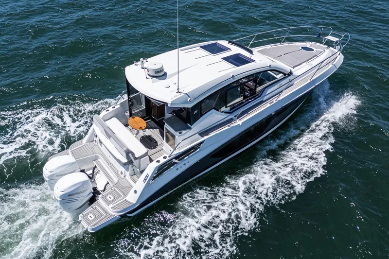 Slide: The Image of 2020 Four Winns Vista 355 Coupe OB cruising on open water. - 16