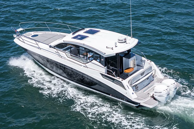 Slide: The Image of 2020 Four Winns Vista 355 Coupe OB cruising on open water. - 17