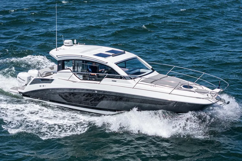 Slide: The Image of 2020 Four Winns Vista 355 Coupe OB cruising on open water. - 18