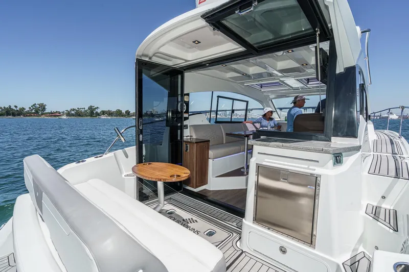 Slide: The Image of 2020 Four Winns Vista 355 Coupe OB yacht interior with open deck and seating area. - 19