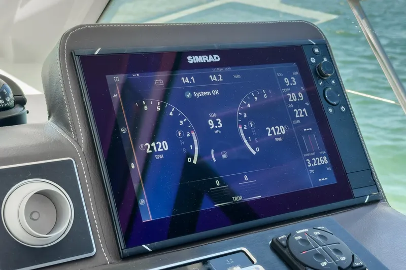 Slide: The Image of Simrad display on 2020 Four Winns Vista 355 Coupe OB showing navigation and engine data. - 36