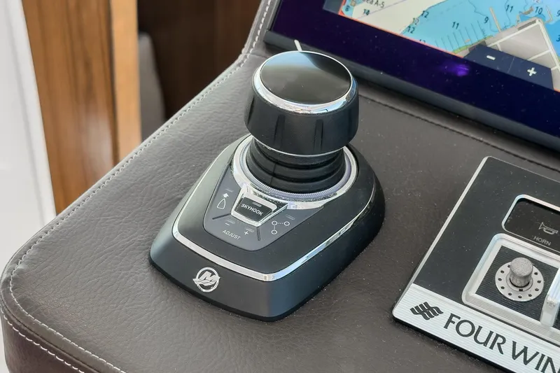 Slide: The Image of Joystick control on 2020 Four Winns Vista 355 Coupe OB boat dashboard. - 37