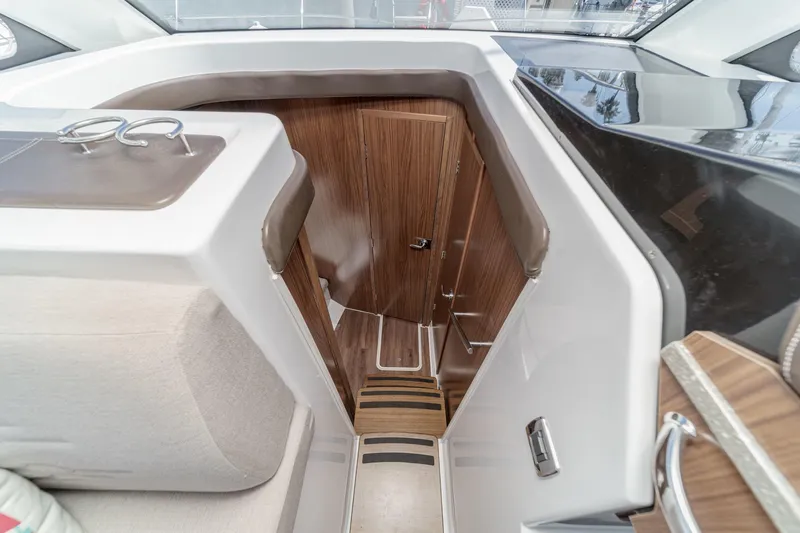 Slide: The Image of Interior view of 2020 Four Winns Vista 355 Coupe OB, featuring sleek wood finishes. - 41
