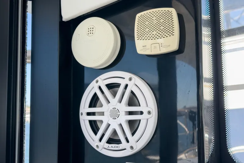 Slide: The Image of 2020 Four Winns Vista 355 Coupe OB interior with speaker and safety devices. - 61