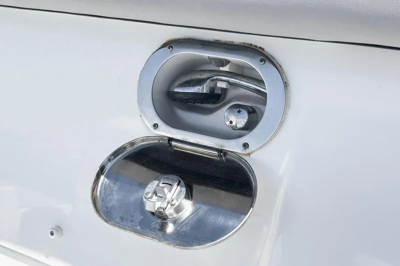 Slide: The Image of Fuel cap of 2020 Four Winns Vista 355 Coupe OB boat, open and metallic. - 65
