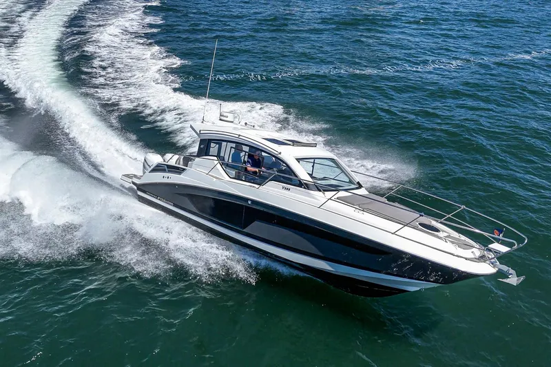 Slide: The Image of 2020 Four Winns Vista 355 Coupe OB cruising on open water. - 7
