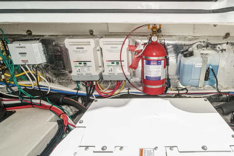 Slide: The Image of Engine compartment of 2020 Four Winns Vista 355 Coupe OB with wiring and fire extinguisher. - 73