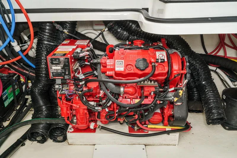 Slide: The Image of Engine compartment of 2020 Four Winns Vista 355 Coupe OB, featuring a red EFI engine. - 74