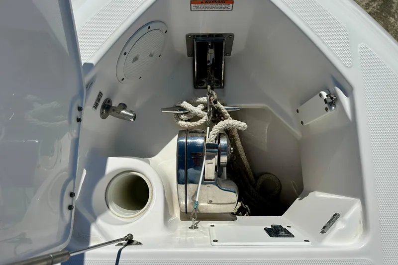 Slide: The Image of 2013 Everglades 325 Center Console boat interior with modern controls and seating. - 13