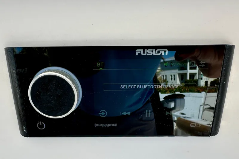 Slide: The Image of Fusion stereo system on a 2013 Everglades 325 Center Console boat, displaying Bluetooth settings. - 16