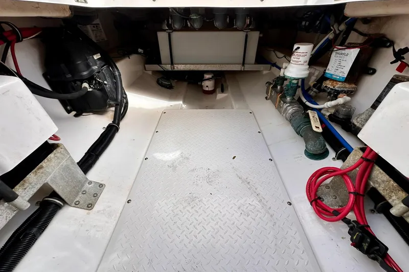 Slide: The Image of Interior view of 2013 Everglades 325 Center Console boat's engine compartment. - 30