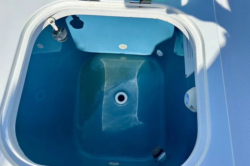 Slide: The Image of 2013 Everglades 325 Center Console boat interior with speaker and seating detail. - 9