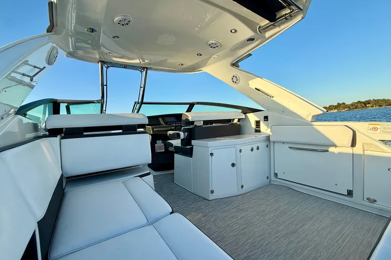 Slide: The Image of 2022 Monterey 385SS Super Sport boat interior with sleek seating and modern design. - 10