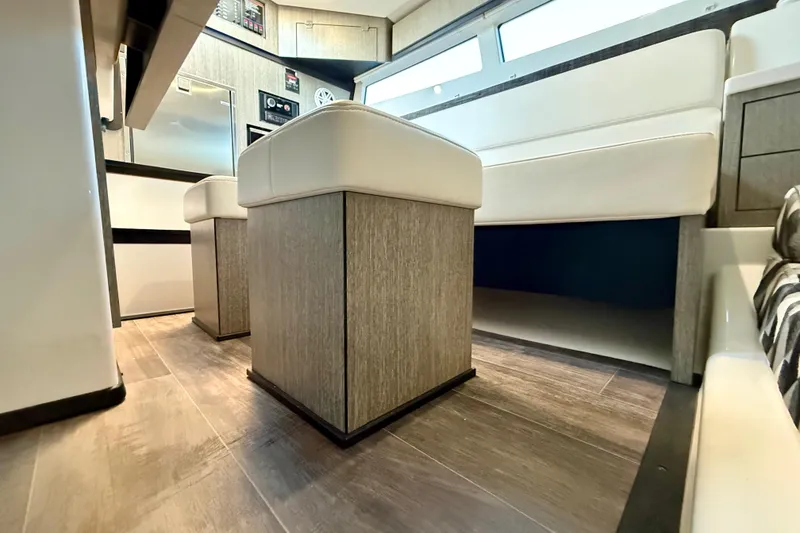 Slide: The Image of 2022 Monterey 385SS Super Sport interior with modern seating and wood flooring. - 28