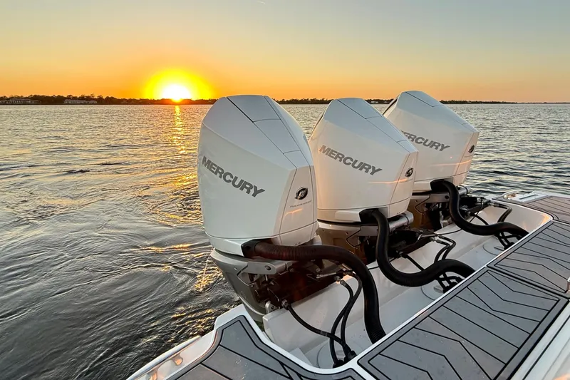 Slide: The Image of 2022 Monterey 385SS Super Sport boat with Mercury engines at sunset on the water. - 33