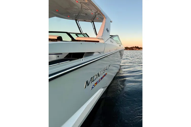 Slide: The Image of 2022 Monterey 385SS Super Sport boat on water at sunset. - 37