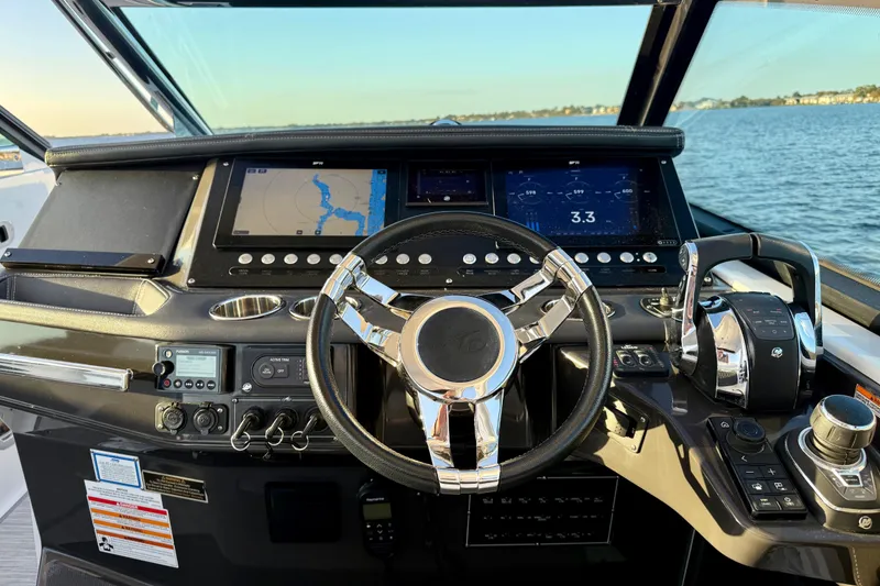 Slide: The Image of Cockpit of 2022 Monterey 385SS Super Sport boat with advanced navigation controls. - 4