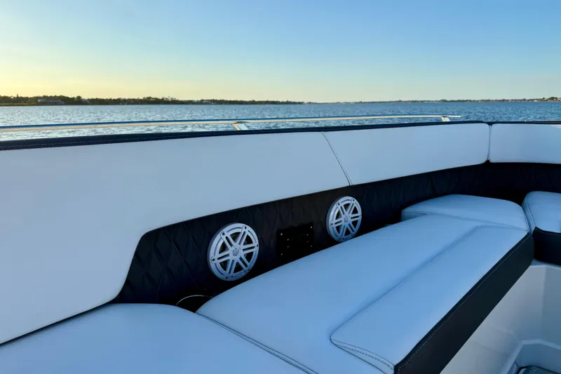 Slide: The Image of Luxurious seating on 2022 Monterey 385SS Super Sport boat with scenic water view. - 6