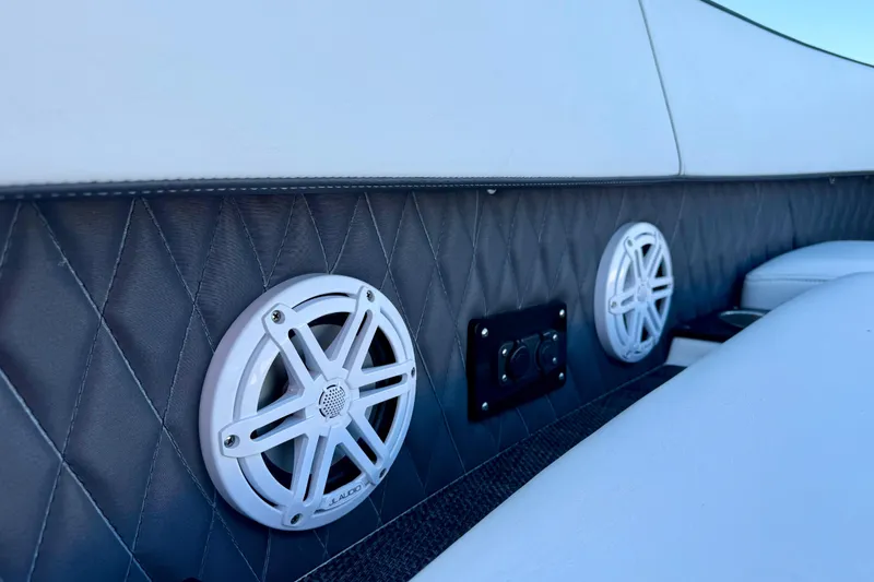 Slide: The Image of 2022 Monterey 385SS Super Sport boat interior with speakers and quilted upholstery. - 7
