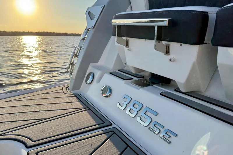 Slide: The Image of 2022 Monterey 385SS Super Sport boat at sunset on the water. - 21
