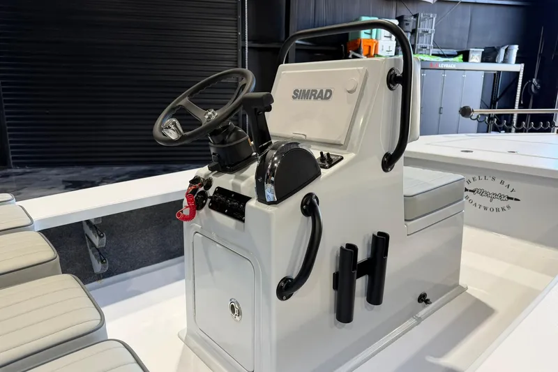 Slide: The Image of 2026 Hell's Bay Marquesa boat console with Simrad electronics in a sleek, modern design. - 6