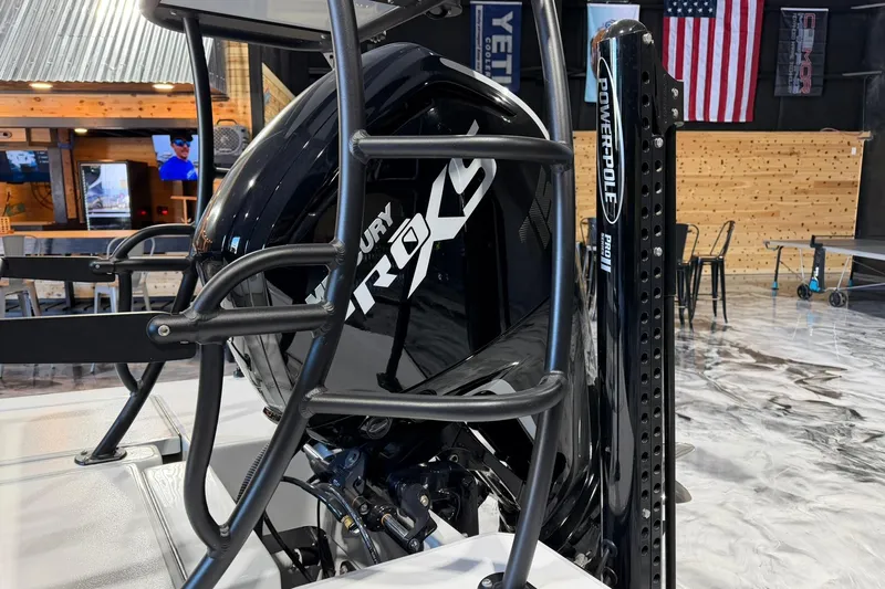 Slide: The Image of 2026 Hell's Bay Marquesa boat with Mercury Pro XS engine and Power-Pole Pro II in a showroom. - 8