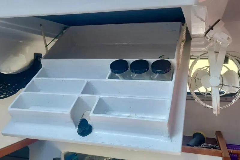 Slide: The Image of Hughes 40 yacht interior storage with spice rack and fan, 2012 model. - 22