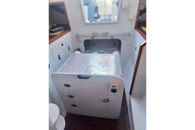 Slide: The Image of Interior of a 2012 Hughes 40 boat, featuring a compact cabin space. - 37