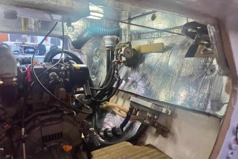 Slide: The Image of Engine compartment of a 2012 Hughes 40, showcasing mechanical components and insulation. - 40