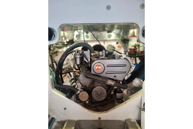 Slide: The Image of Engine compartment of a 2012 Hughes 40, showcasing mechanical components and wiring. - 41