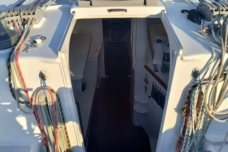 Slide: The Image of Interior view of a 2012 Hughes 40 sailboat cockpit with ropes and control panel. - 43