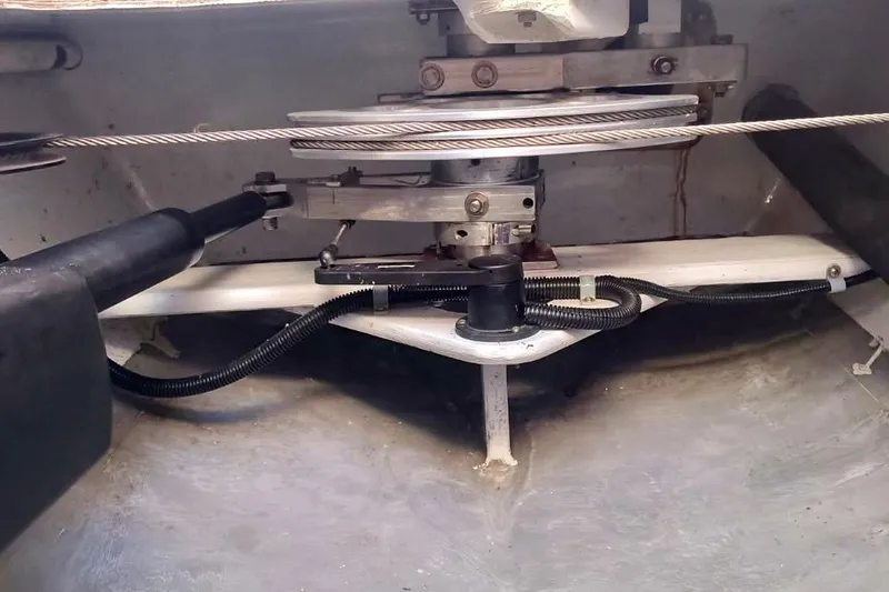 Slide: The Image of Steering mechanism of a 2012 Hughes 40 boat, featuring cables and pulleys. - 44