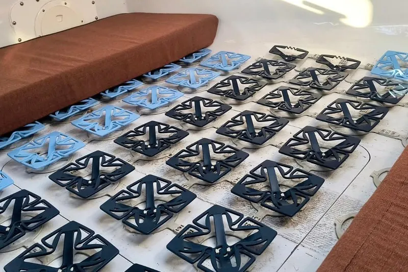 Slide: The Image of Interior of a 2012 Hughes 40 with grid-like floor structure and brown seating. - 45