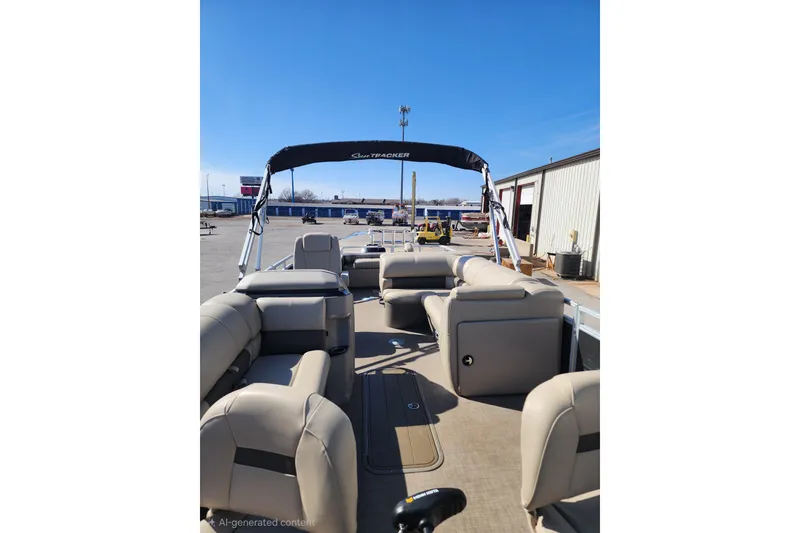 Slide: The Image of 2024 Sun Tracker Fishin' Barge 22 XP3 pontoon boat with spacious seating and canopy. - 3
