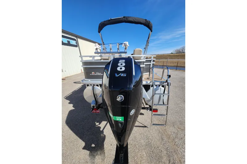 Slide: The Image of 2024 Sun Tracker Fishin' Barge 22 XP3 with powerful V6 engine, docked outdoors. - 4