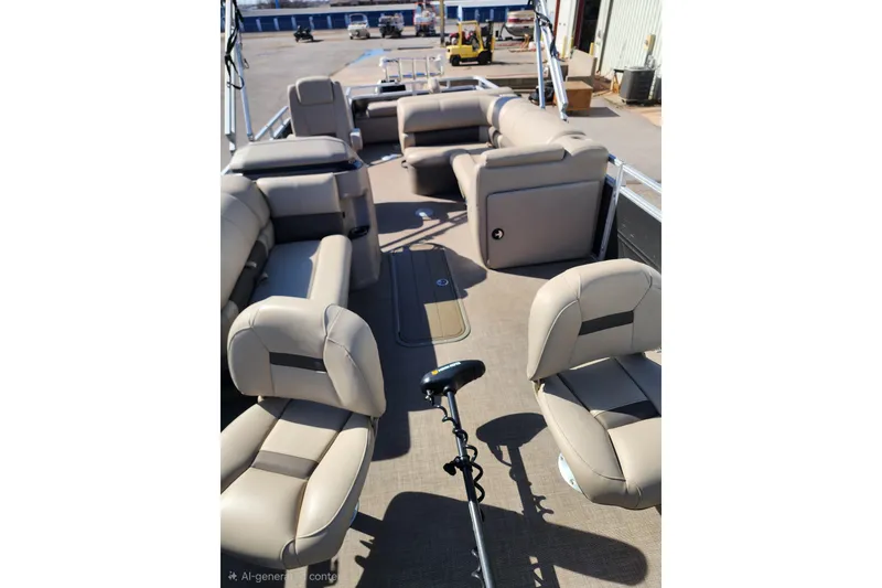 Slide: The Image of 2024 Sun Tracker Fishin' Barge 22 XP3 interior with beige seating and fishing equipment. - 7